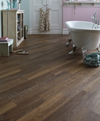 Welcoming bathroom with dark Karndean flooring